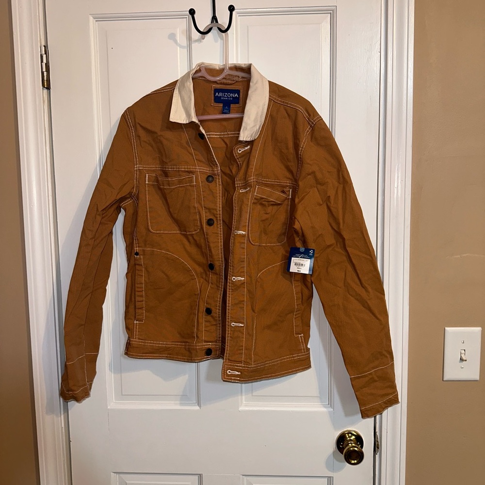 Light brown jean jacket. Jc penny. Never worn